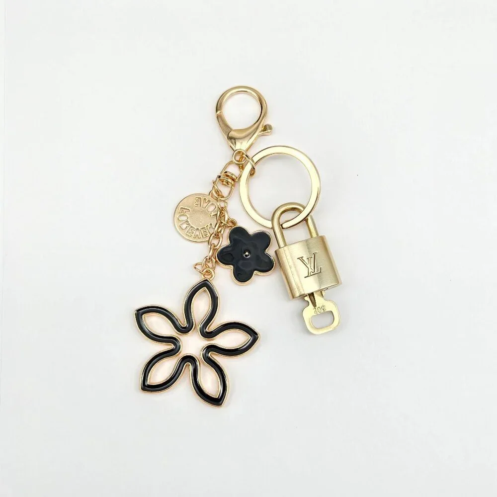 Louis Vuitton Gold-Tone Crystal Flower Keychain with Black Accent